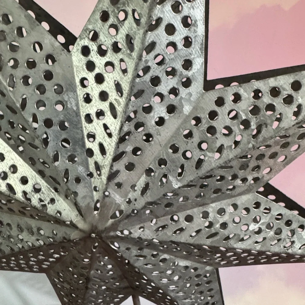 Silver Star Tree Topper Eight-point 3D star with intricate punch-work